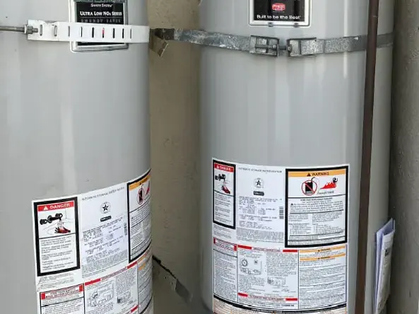 Two strapped tank water heaters in a garage, Granada Hills water heater leak cleanup